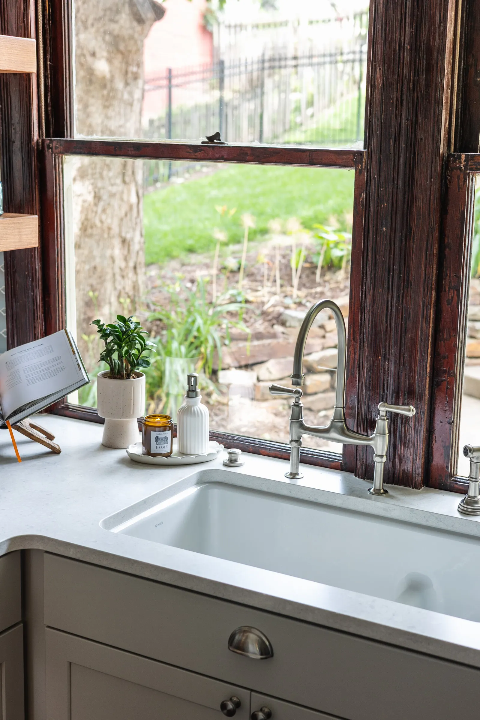 1900 Kitchen Remodel, wood floors, light blue tile backsplash, hardwood floors, open shelving, brushed nickel hardware, wolf oven, stainless steel appliances, custom hood, custom cabinetry, Omaha Nebraska, remodeling and renovations.