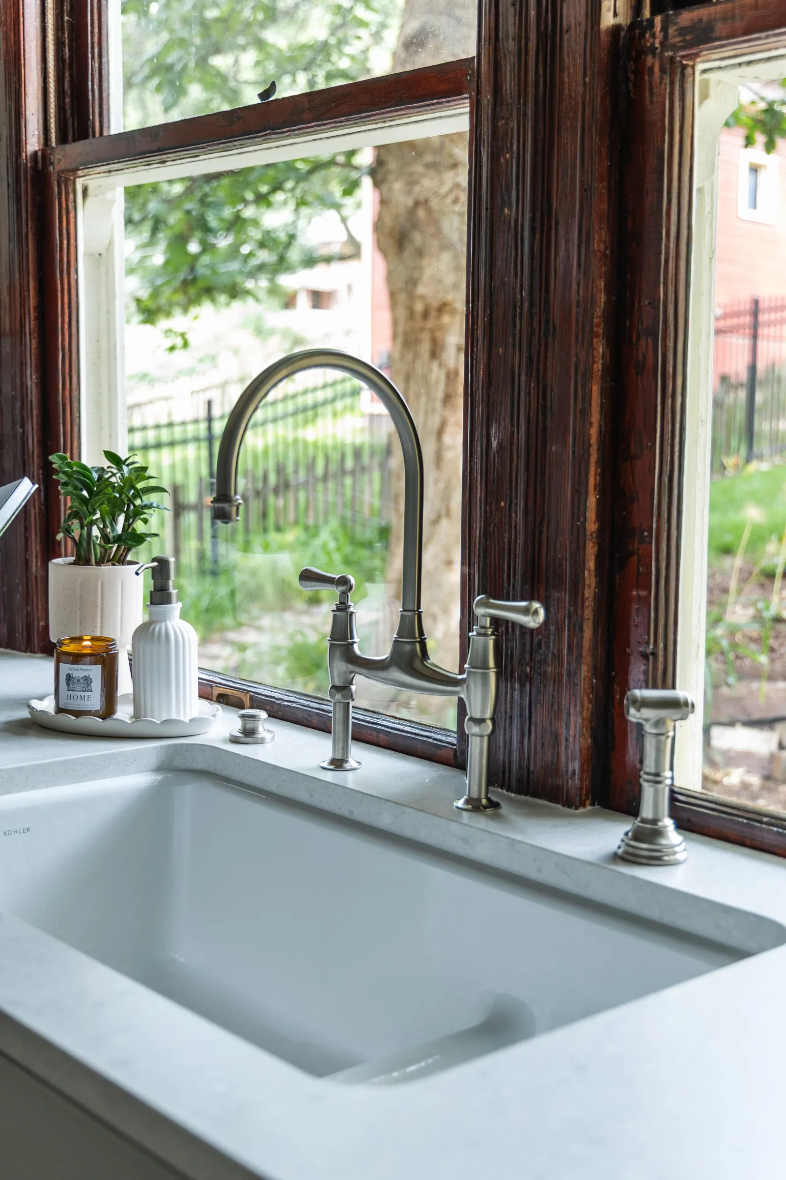 1900 Kitchen Remodel, wood floors, light blue tile backsplash, hardwood floors, open shelving, brushed nickel hardware, wolf oven, stainless steel appliances, custom hood, custom cabinetry, Omaha Nebraska, remodeling and renovations.