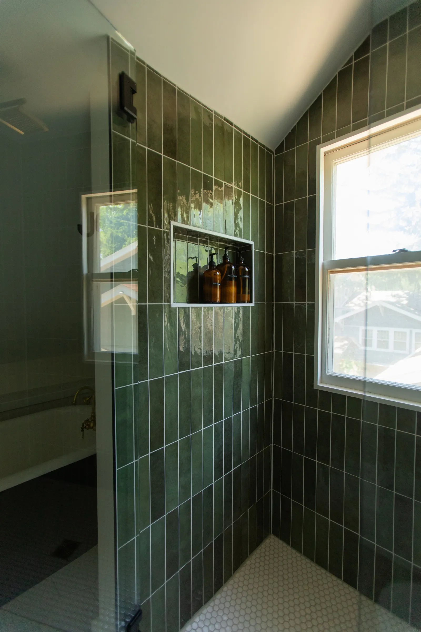 1920 Bathroom Remodel, custom wood vanity, brushed gold hardware, brushed gold sconces, modern design, mixed metal finishes, green subway tile, white hexagon floor tile, Lincoln Nebraska, professional contractors, remodeling and renovations.
