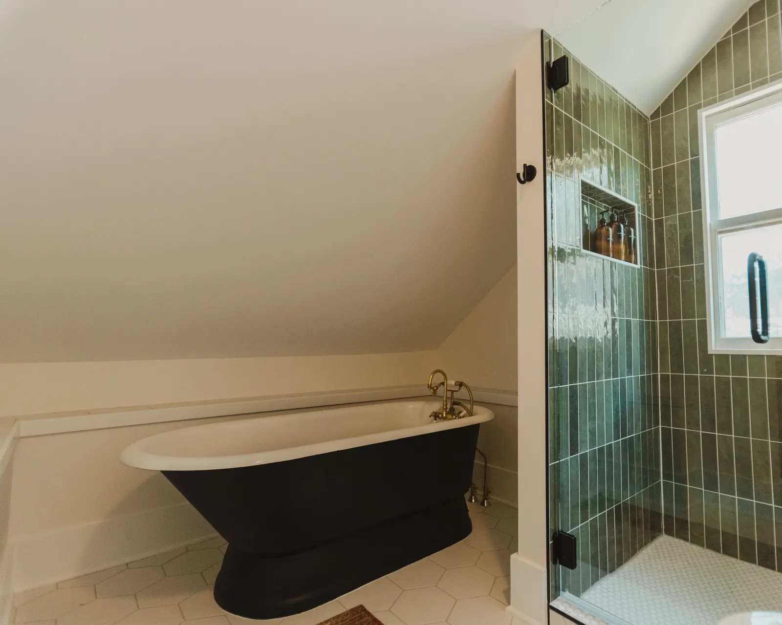 1920 Bathroom Remodel, custom wood vanity, brushed gold hardware, brushed gold sconces, modern design, mixed metal finishes, green subway tile, white hexagon floor tile, Lincoln Nebraska, professional contractors, remodeling and renovations.
