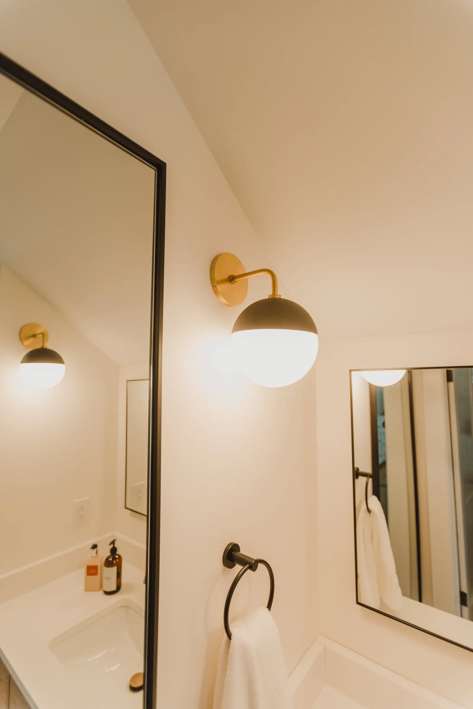1920 Bathroom Remodel, custom wood vanity, brushed gold hardware, brushed gold sconces, modern design, mixed metal finishes, green subway tile, white hexagon floor tile, Lincoln Nebraska, professional contractors, remodeling and renovations.