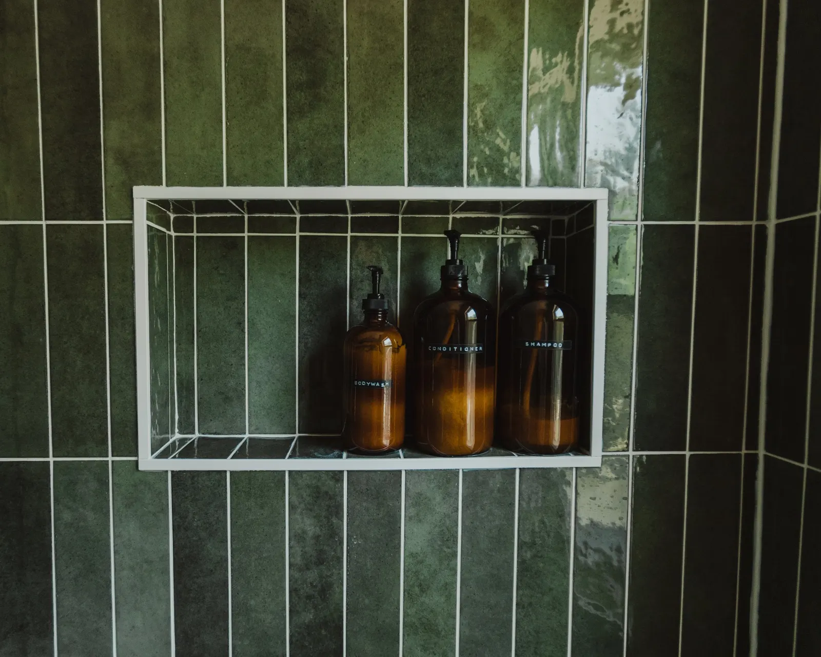 1920 Bathroom Remodel, custom wood vanity, brushed gold hardware, brushed gold sconces, modern design, mixed metal finishes, green subway tile, white hexagon floor tile, Lincoln Nebraska, professional contractors, remodeling and renovations.