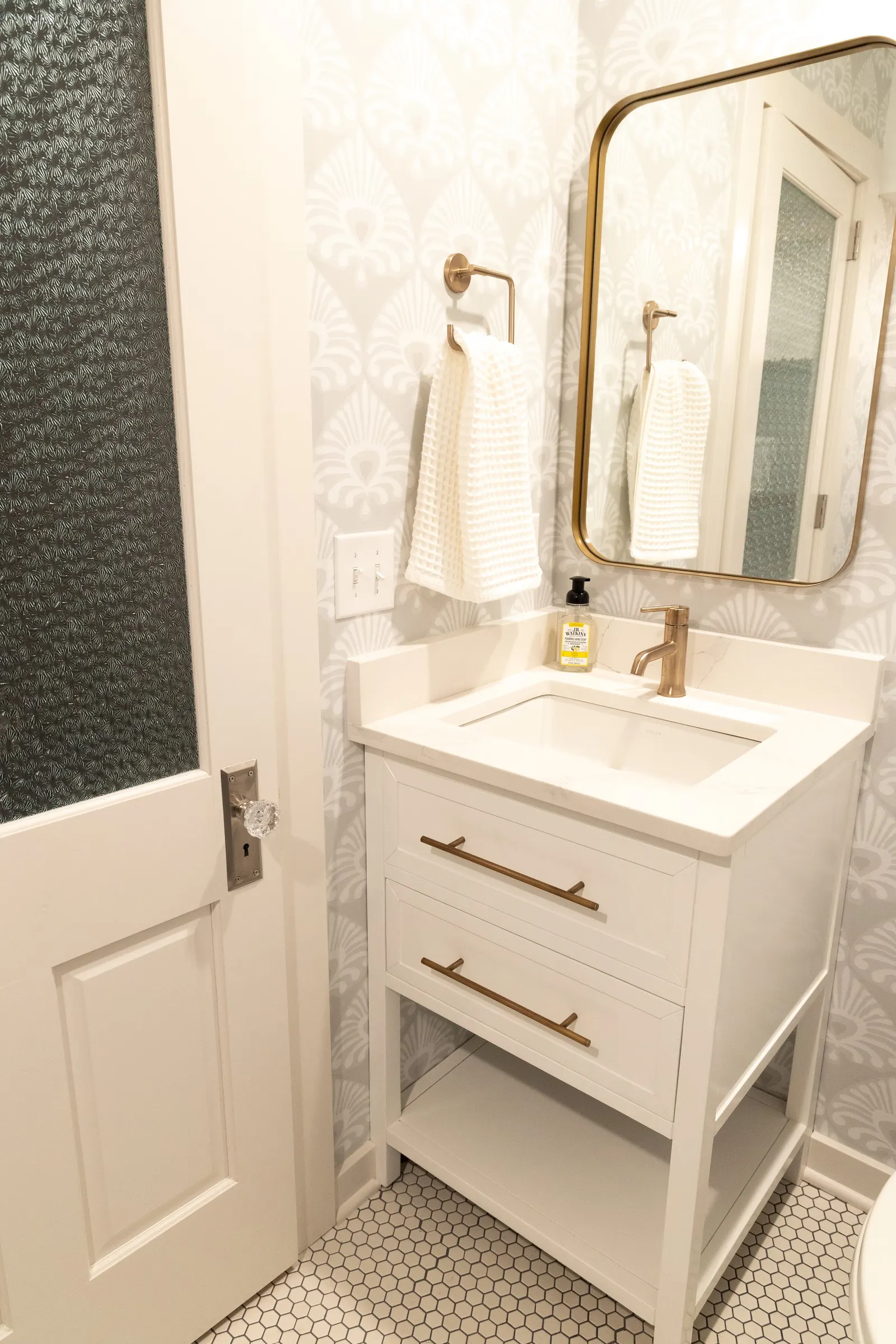 1922 Bathroom Remodel, whole home remodel, vintage door, vintage hardware, wallpaper, brushed gold finishes, open shelving, floating shelves, Lincoln Nebraska, professional contractors, remodeling and renovations.