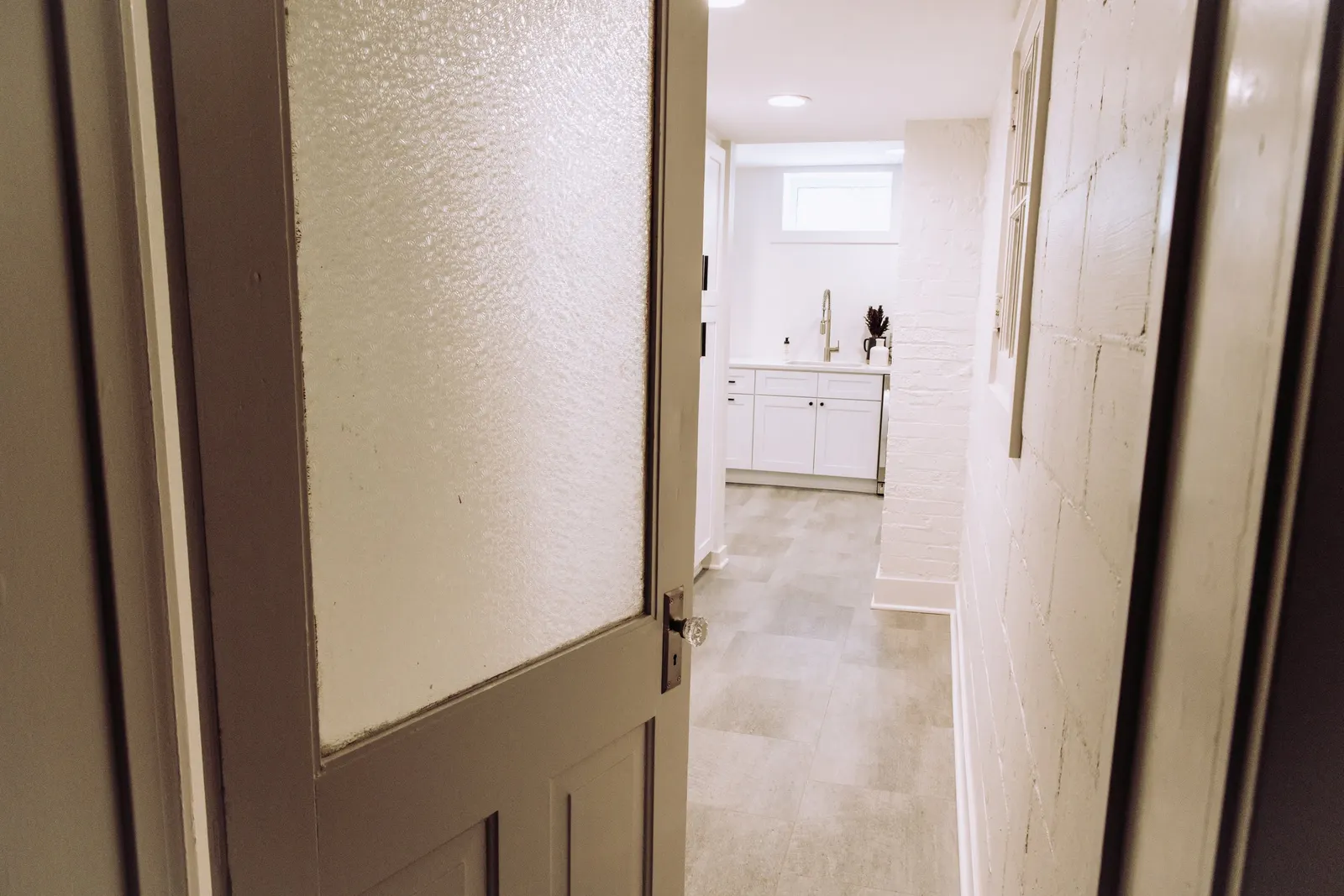 1922 Bathroom Remodel, whole home remodel, vintage door, vintage hardware, Lincoln Nebraska, professional contractors.