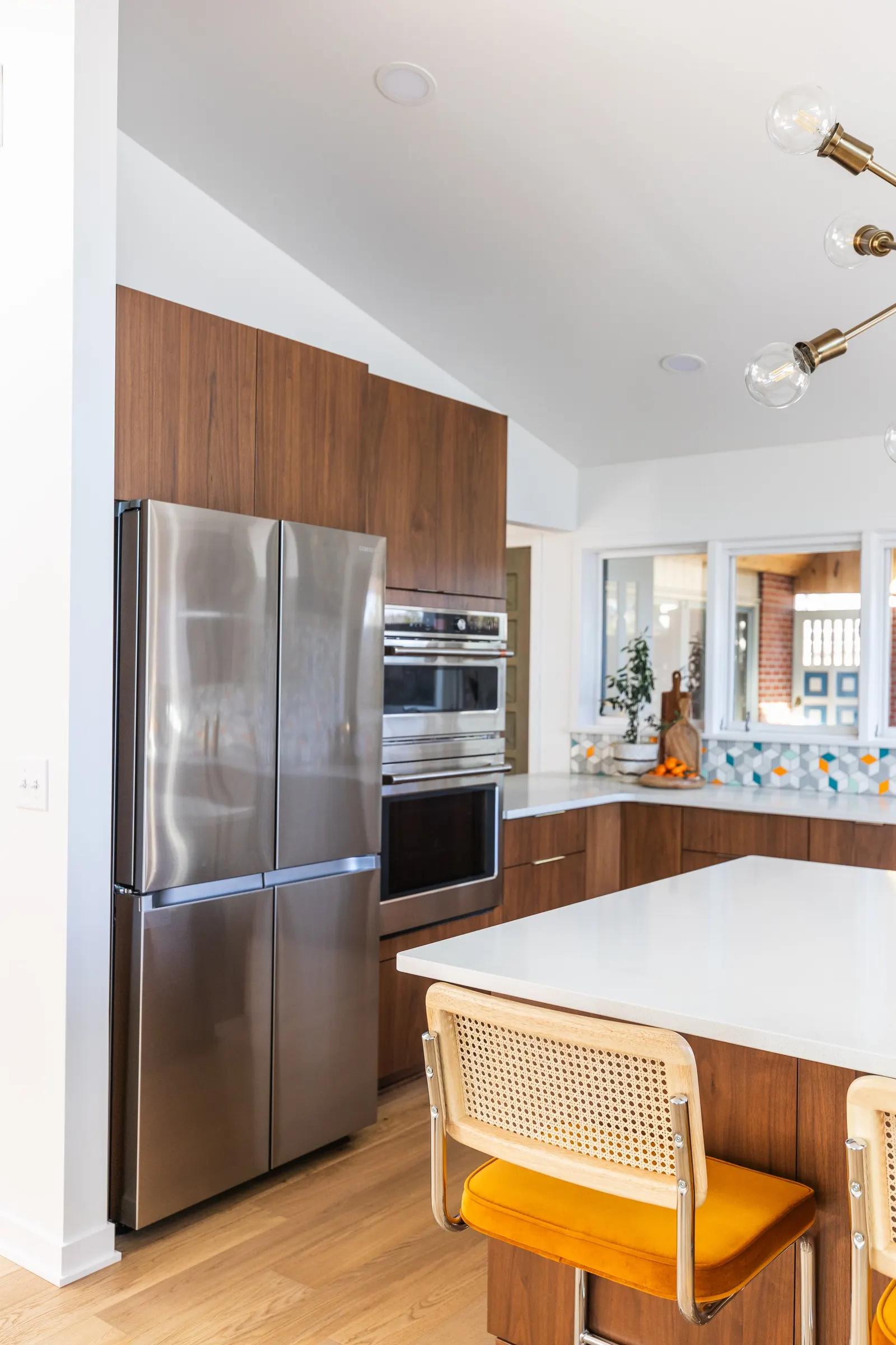 1956 Kitchen Remodel, mid century modern design, mixed metals, wood cabinets, colorful tile backsplash, white quartz countertops, large windows, wood floors, vaulted ceilings, craftsmanship, custom cabinets, large island.