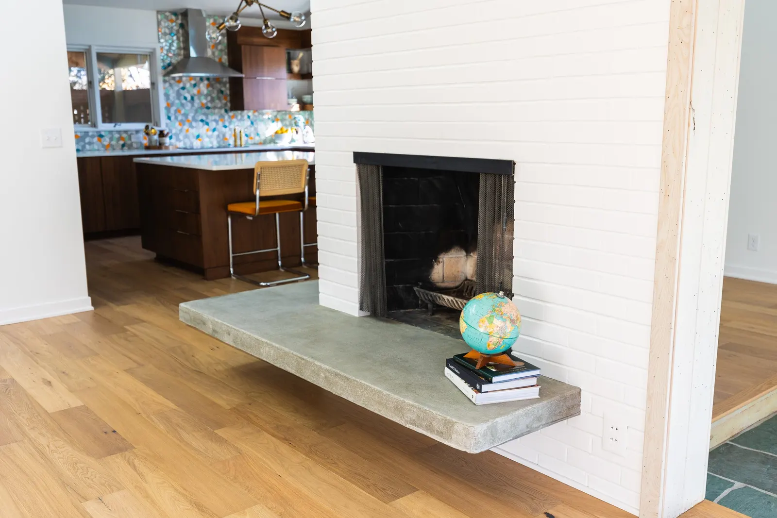 1956 Kitchen Remodel, mid century modern design, mixed metals, wood cabinets, colorful tile backsplash, white quartz countertops, large windows, wood floors, vaulted ceilings, craftsmanship, brick fireplace, custom hearth.