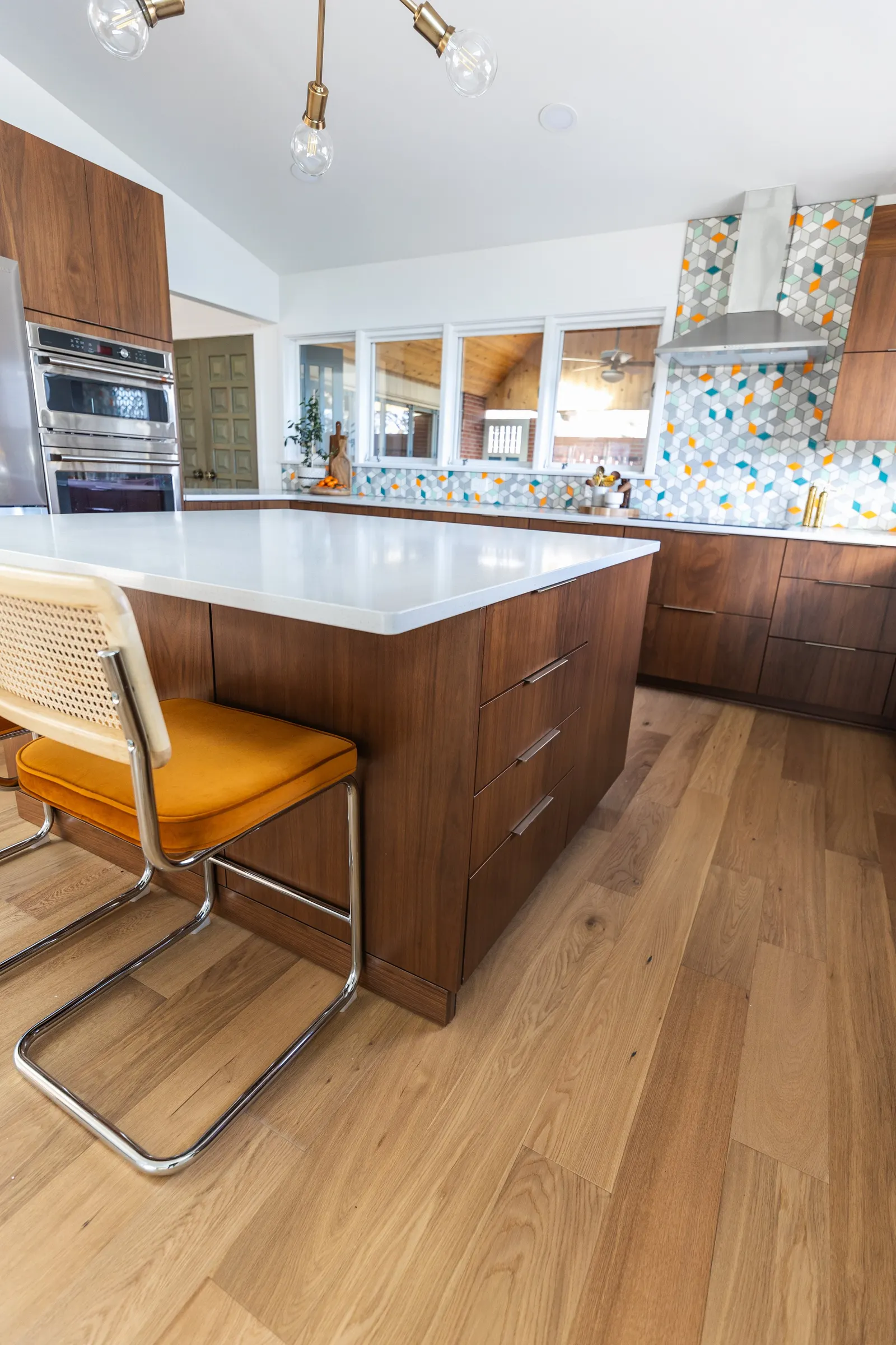 1956 Kitchen Remodel, mid century modern design, mixed metals, wood cabinets, colorful tile backsplash, white quartz countertops, large windows, wood floors, vaulted ceilings, craftsmanship, custom cabinets, large island.