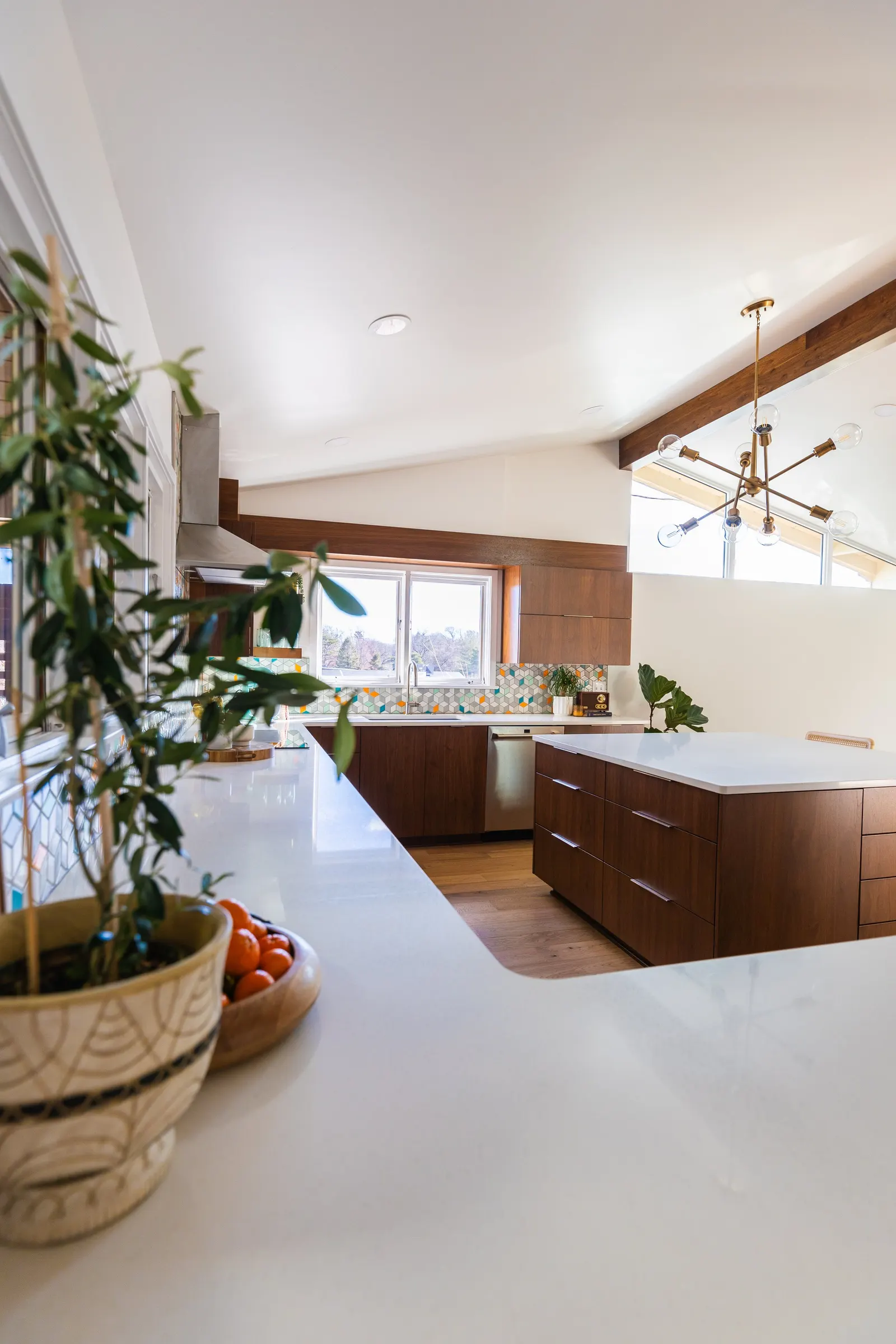 1956 Kitchen Remodel, mid century modern design, mixed metals, wood cabinets, colorful tile backsplash, white quartz countertops, large windows, wood floors, vaulted ceilings, craftsmanship, custom cabinets, large island.