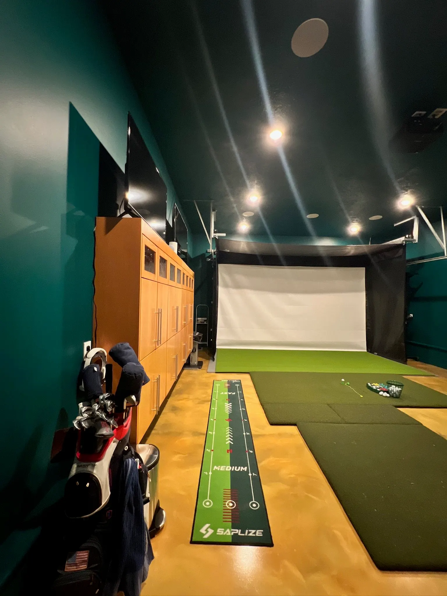 2007 Garage Remodel, whole home remodel, custom wood cabinets, epoxy floor, golf simulator, Lincoln Nebraska, custom stairs, craftsmanship, professional contractors
