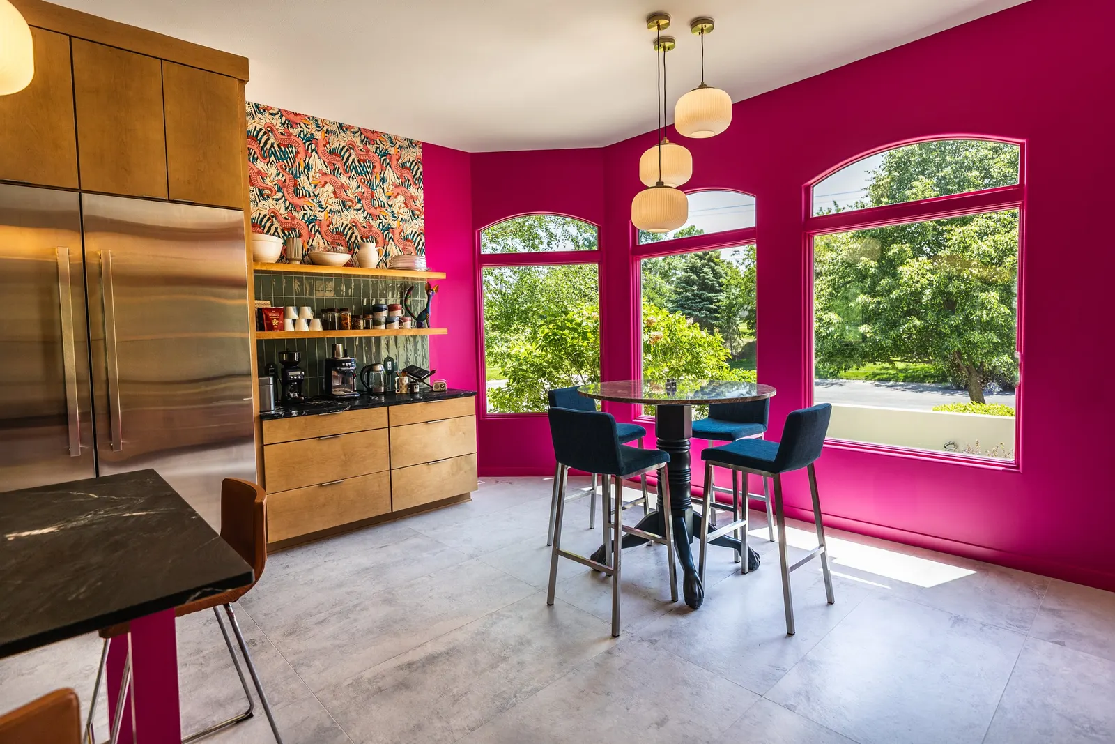 2007 Kitchen Remodel, vibrant pink accents, green tile backsplash, wooden cabinets, brushed nickel hardware, quartz countertop, large island, pendant lights, open shelving, floating shelves, tile floor, coffee bar, wallpaper, eat in kitchen, addition