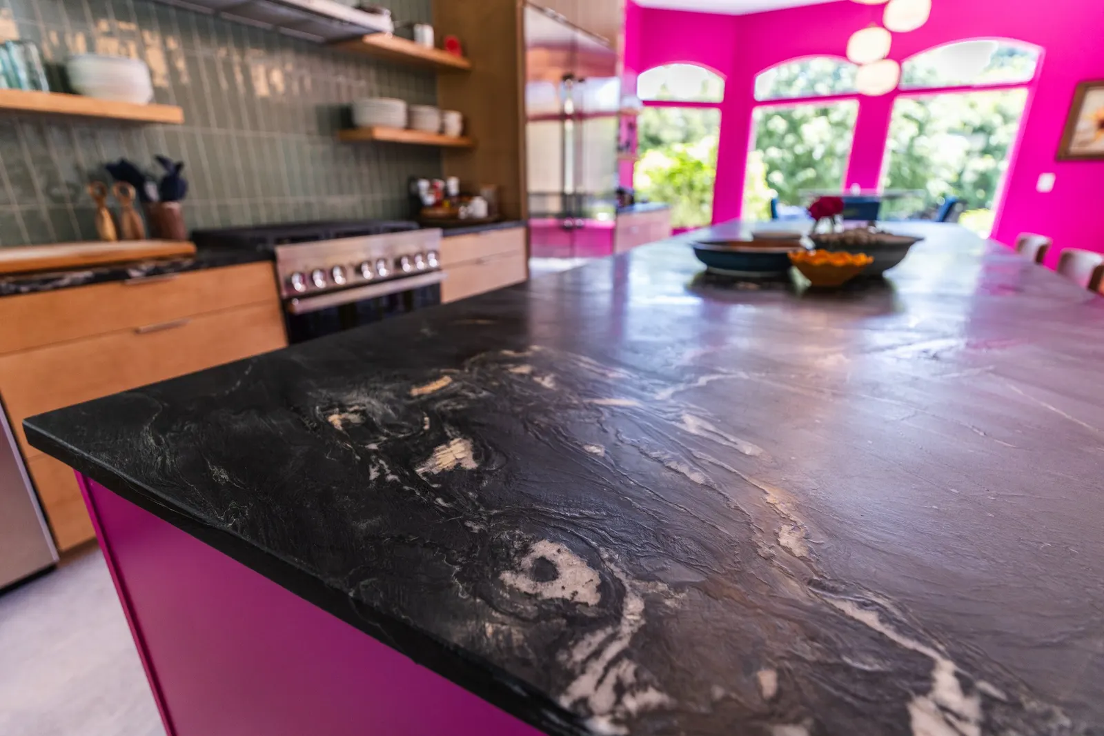 2007 Kitchen Remodel, vibrant pink accents, green tile backsplash, wooden cabinets, brushed nickel hardware, quartz countertop, large island, pendant lights, open shelving, floating shelves, tile floor, coffee bar, wallpaper, eat in kitchen, addition