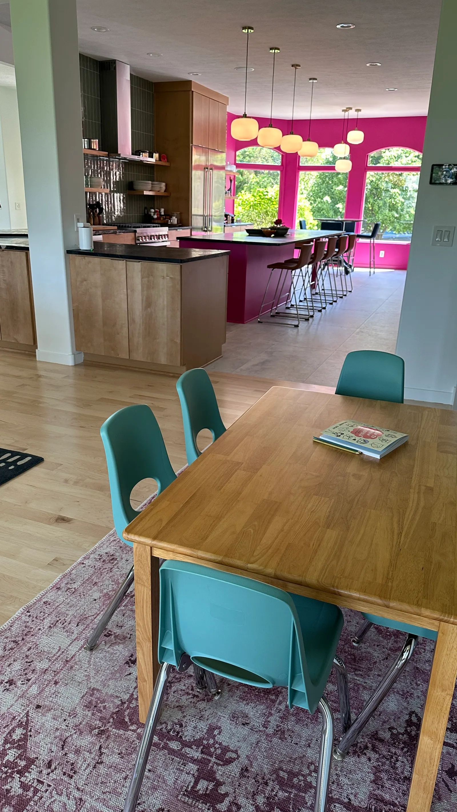2007 Kitchen Remodel, vibrant pink accents, green tile backsplash, wooden cabinets, brushed nickel hardware, quartz countertop, large island, pendant lights, open shelving, floating shelves, tile floor, coffee bar, wallpaper, eat in kitchen, addition