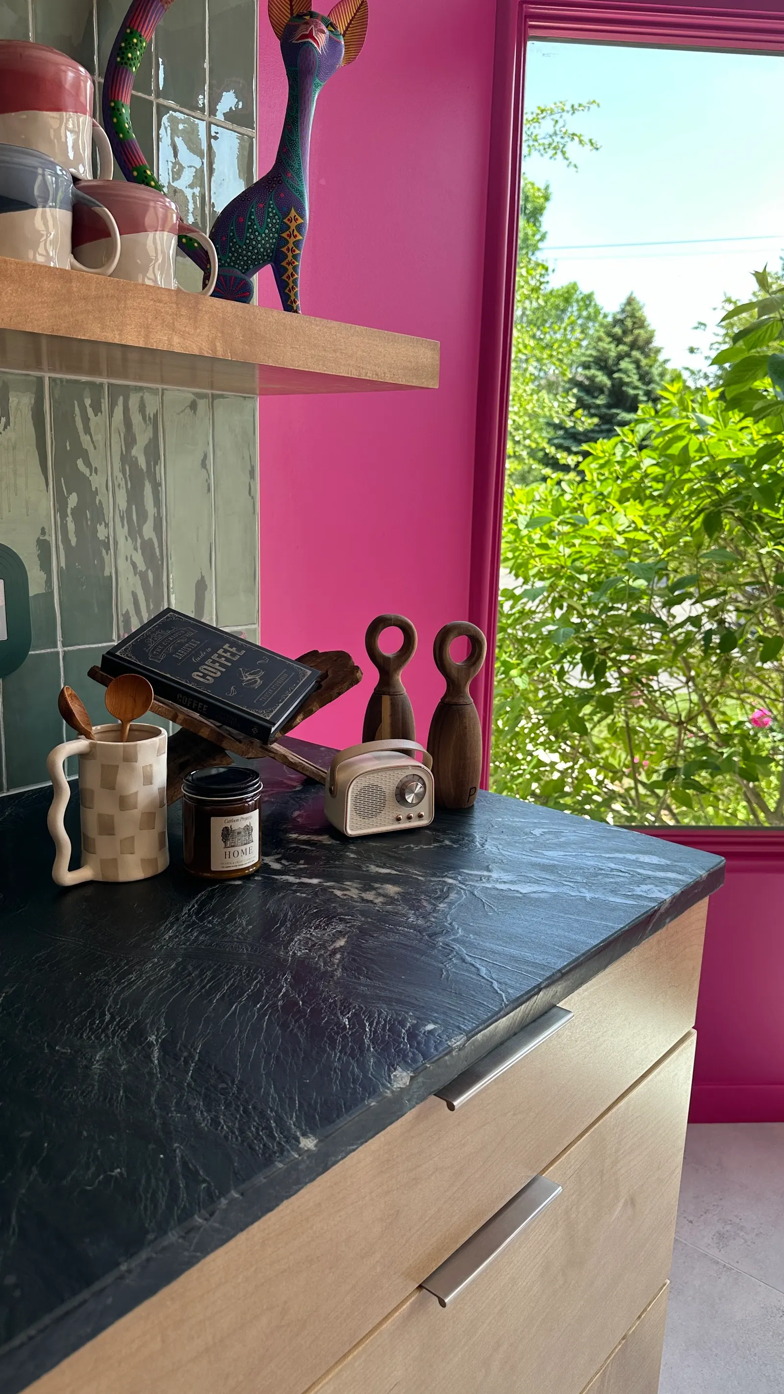 2007 Kitchen Remodel, vibrant pink accents, green tile backsplash, wooden cabinets, brushed nickel hardware, quartz countertop, large island, pendant lights, open shelving, floating shelves, tile floor, coffee bar, wallpaper, eat in kitchen, addition