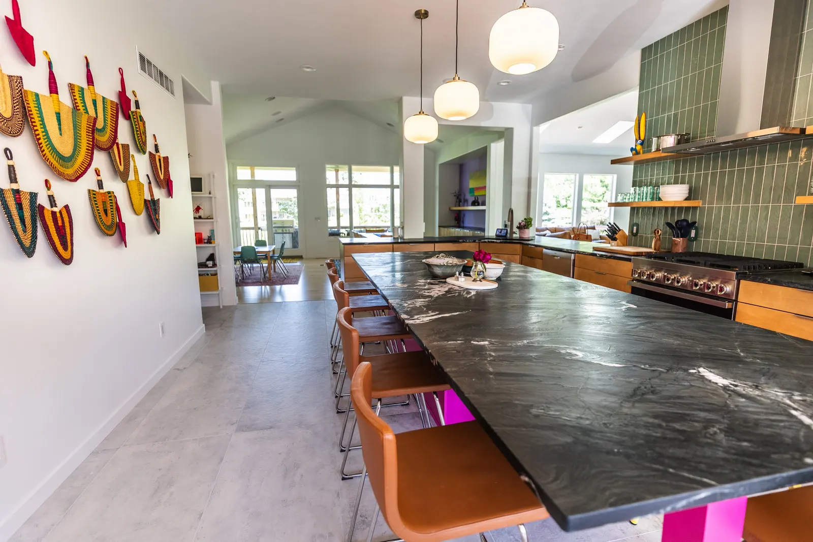 2007 Kitchen Remodel, vibrant pink accents, green tile backsplash, wooden cabinets, brushed nickel hardware, quartz countertop, large island, pendant lights, open shelving, floating shelves, tile floor, coffee bar, wallpaper, eat in kitchen, addition