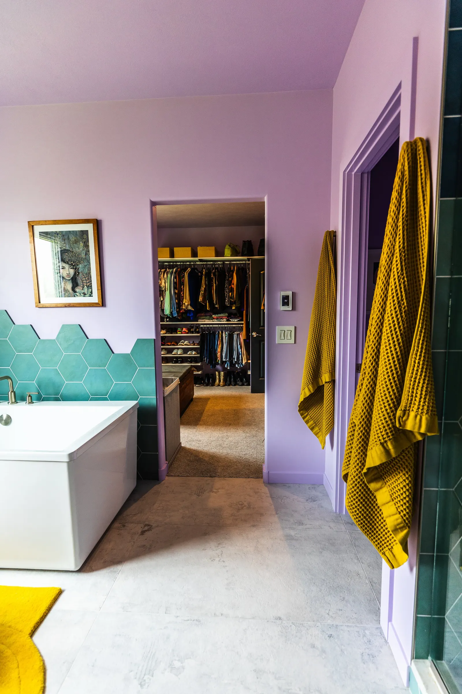 2007 Primary En-Suite Remodel, color drenching, violet, large windows, unique light fixtures, primary suite, tile floors, bathtub, hexagon tile, brushed nickel fixtures, brushed nickel hardware, bathroom suite, wood vanity, bathroom storage.