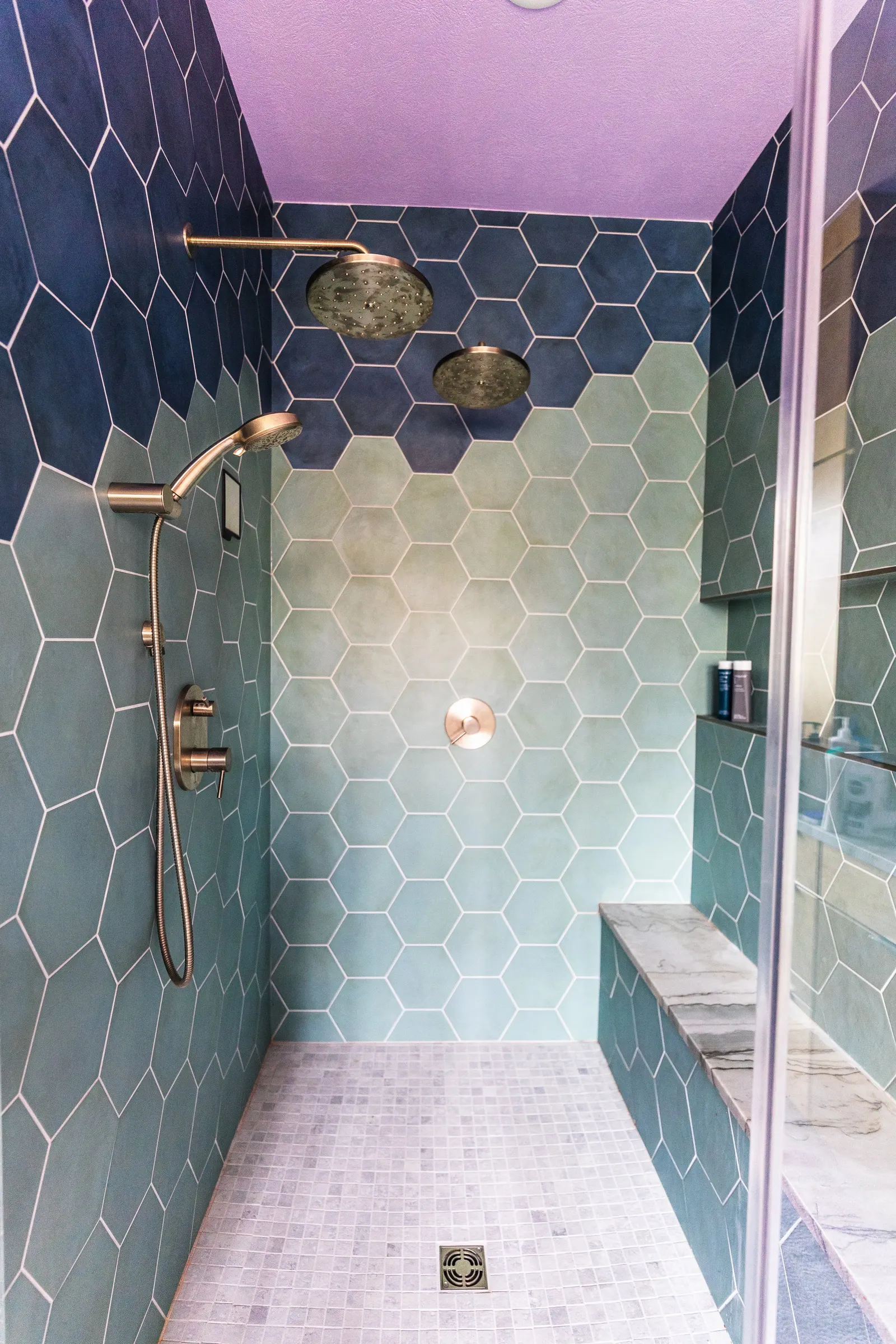 2007 Primary En-Suite Remodel, color drenching, violet, large windows, unique light fixtures, primary suite, tile floors, bathtub, hexagon tile, brushed nickel fixtures, brushed nickel hardware, bathroom suite, walk-in shower.