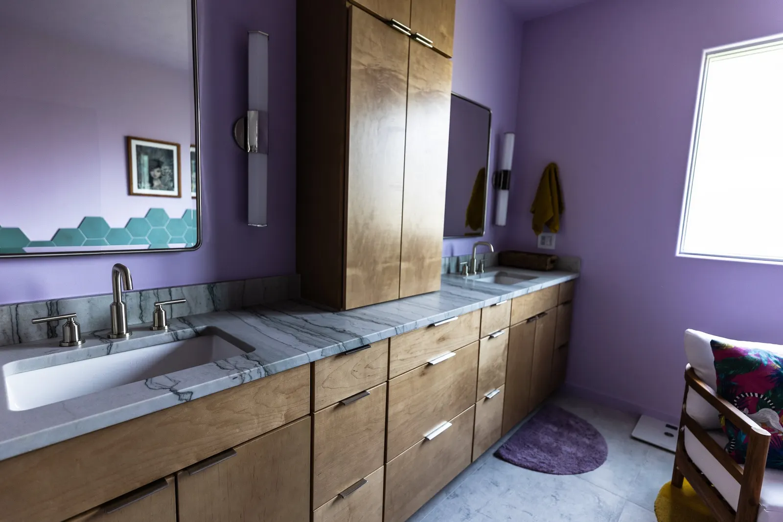 2007 Primary En-Suite Remodel, color drenching, violet, large windows, unique light fixtures, primary suite, tile floors, bathtub, hexagon tile, brushed nickel fixtures, brushed nickel hardware, bathroom suite, wood vanity, bathroom storage.