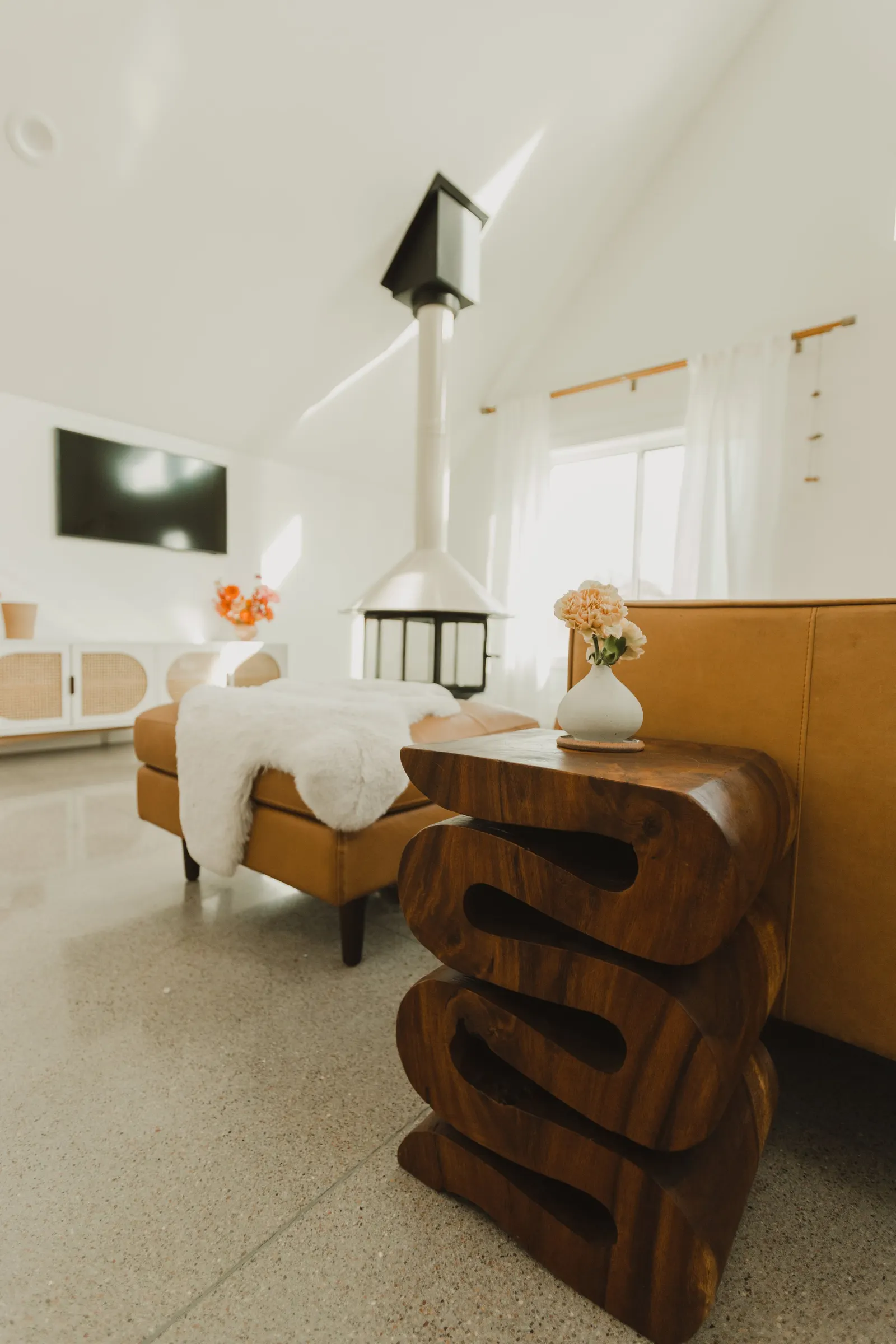 Modern living room, cement floors, open-plan living room, high vaulted ceiling, large windows, Dahlia House, new build, custom home, Air bnb, mid century design, modern, fireplace, modern design, fireplace, boho chic, craftsmanship.
