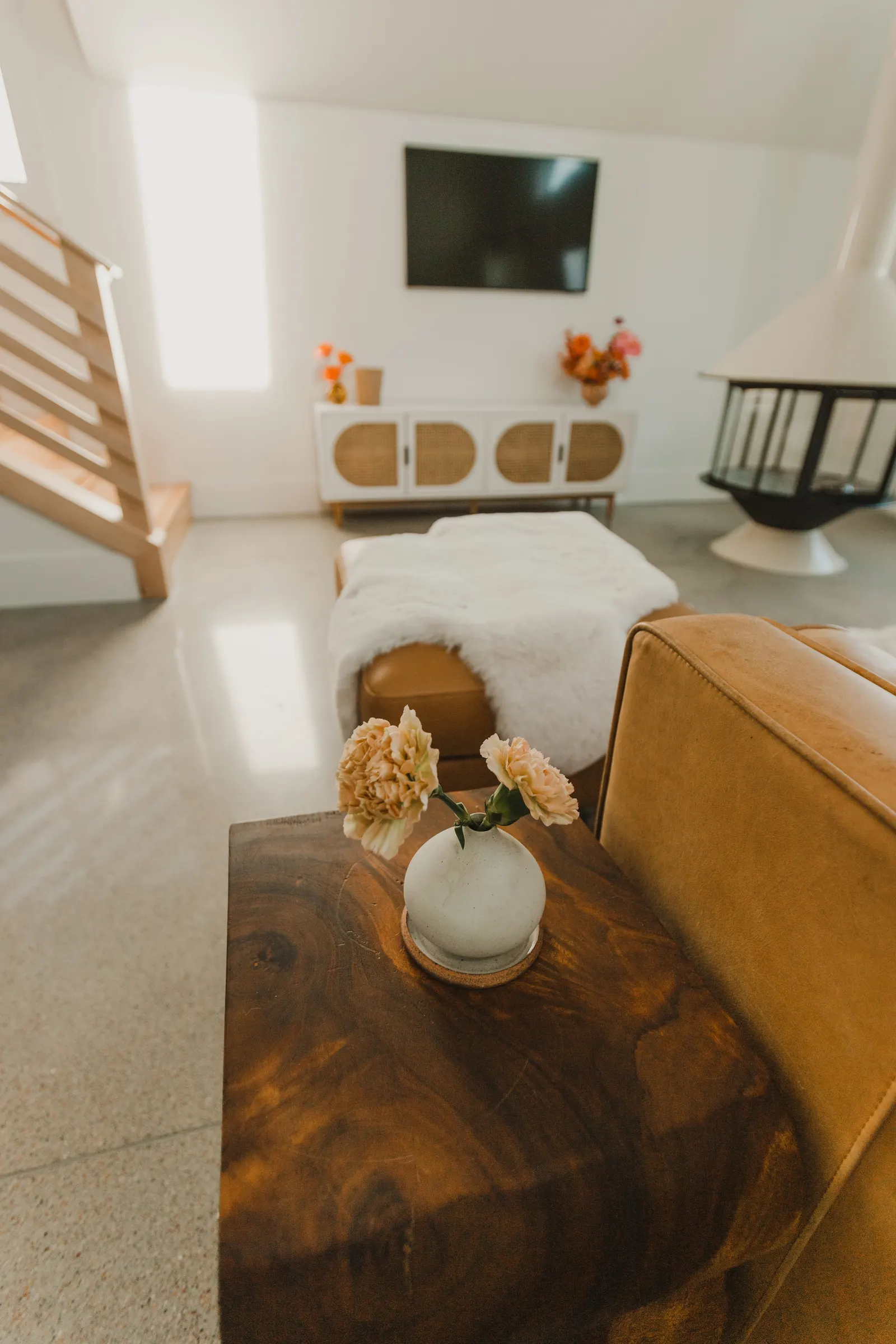 Modern living room, cement floors, open-plan living room, high vaulted ceiling, large windows, Dahlia House, new build, custom home, Air bnb, mid century design, modern, fireplace, modern design, fireplace, boho chic, craftsmanship