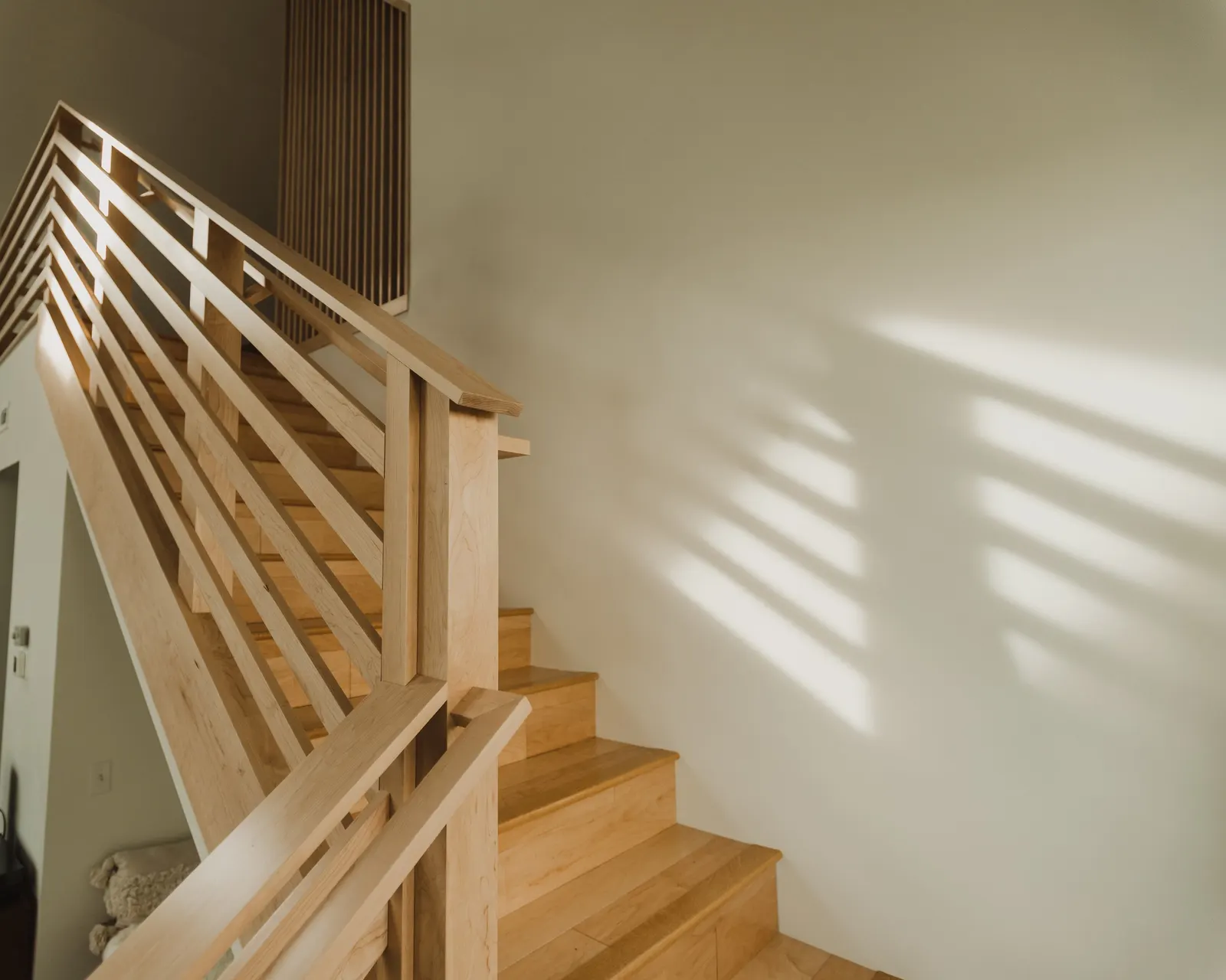Wooden staircase, open-plan, high vaulted ceiling, large windows, Dahlia House, new build, custom home, Air bnb, mid century design, modern, boho chic, custom staircase, craftsmanship