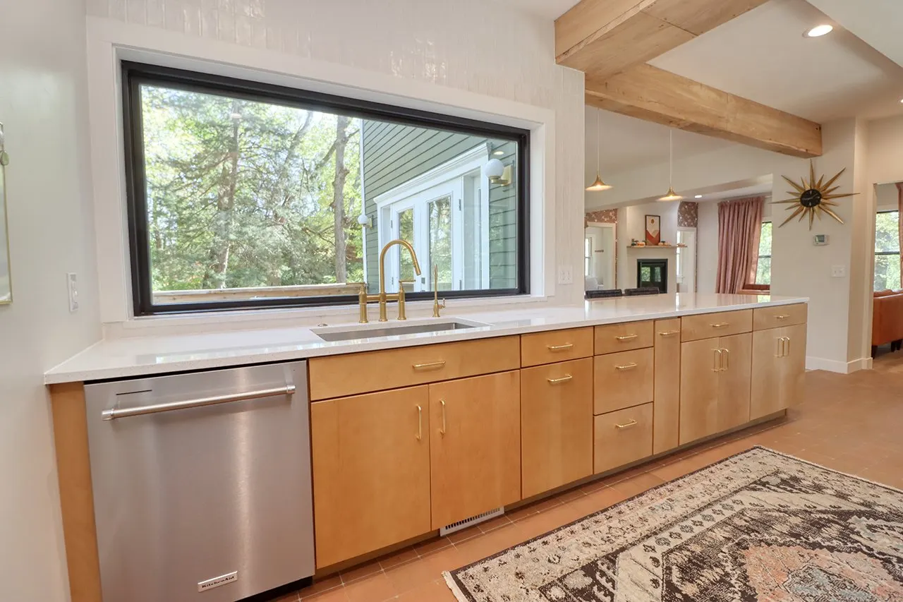 Forest House Kitchen Remodel, Whole Home Remodel, gold hardware, boho chic, farmhouse sink, custom hood, custom wood cabinets, tile floor, stainless steel appliances, white quartz countertops, large windows.