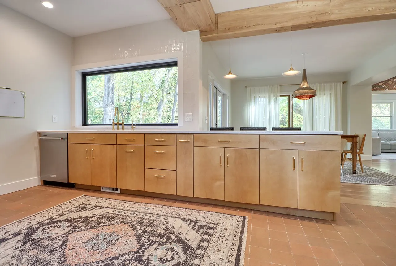 Forest House Kitchen Remodel, Whole Home Remodel, gold hardware, boho chic, farmhouse sink, custom hood, custom wood cabinets, tile floor, stainless steel appliances, white quartz countertops, large windows, wood beams, craftsmanship.