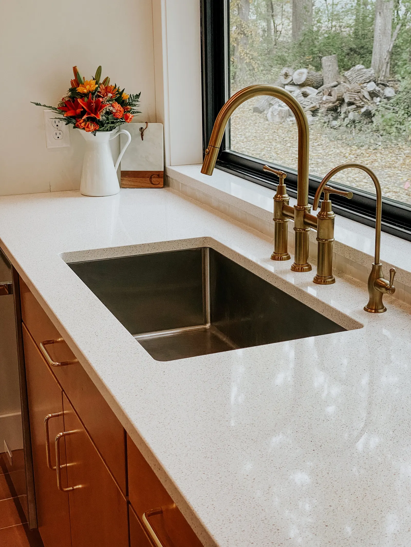 Forest House Kitchen Remodel, Whole Home Remodel, gold hardware, boho chic, farmhouse sink, custom hood, custom wood cabinets, tile floor, stainless steel appliances, white quartz countertops, large windows, wood beams, craftsmanship.