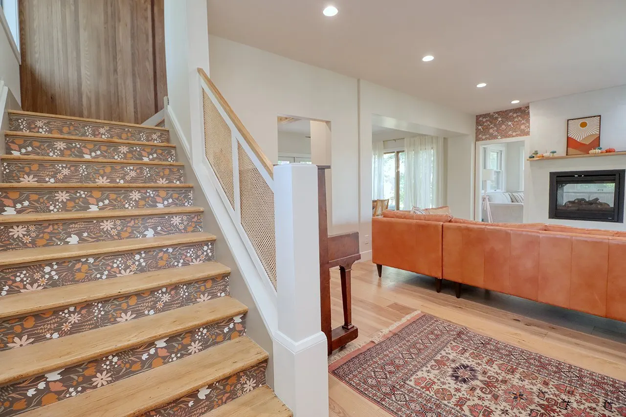 Forest House Remodel, whole home remodel, wallpaper stairs, wood floors, boho chic, mid century modern design, fireplace, wood mantel.