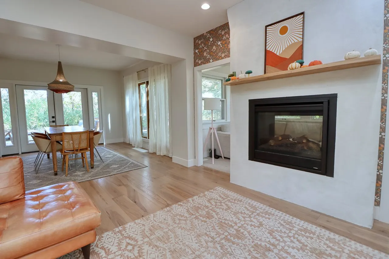 Forest House Remodel, whole home remodel, open plan concept, wood floors, boho chic, mid century modern design, fireplace, wood mantel.