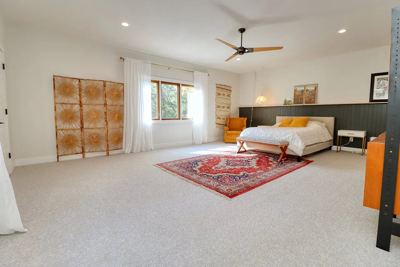 Forest House Primary Bedroom Remodel, wool carpet, mid century modern design, large windows, wood fan