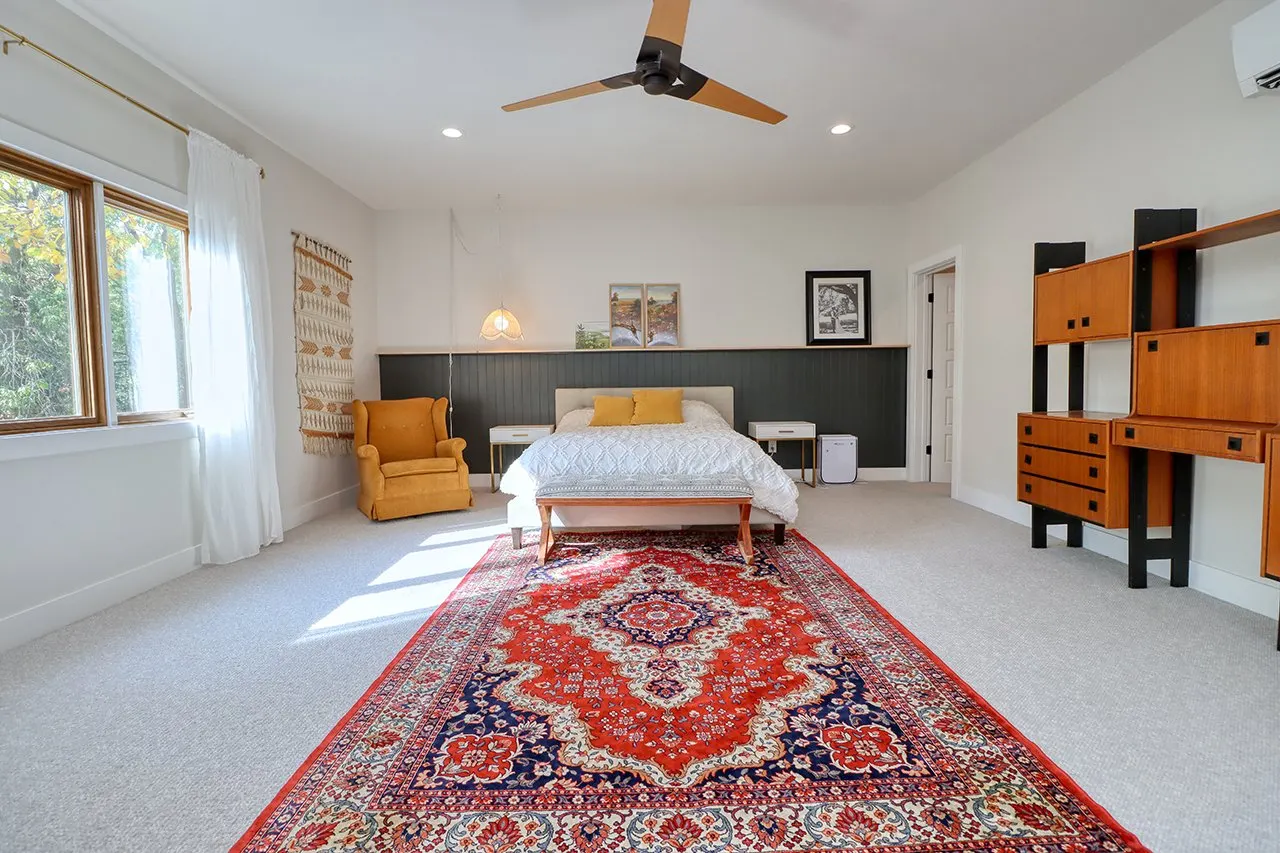 Forest House Primary Bedroom Remodel, wool carpet, mid century modern design, large windows, wood fan